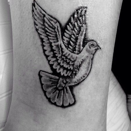 Значение татуировки голубь